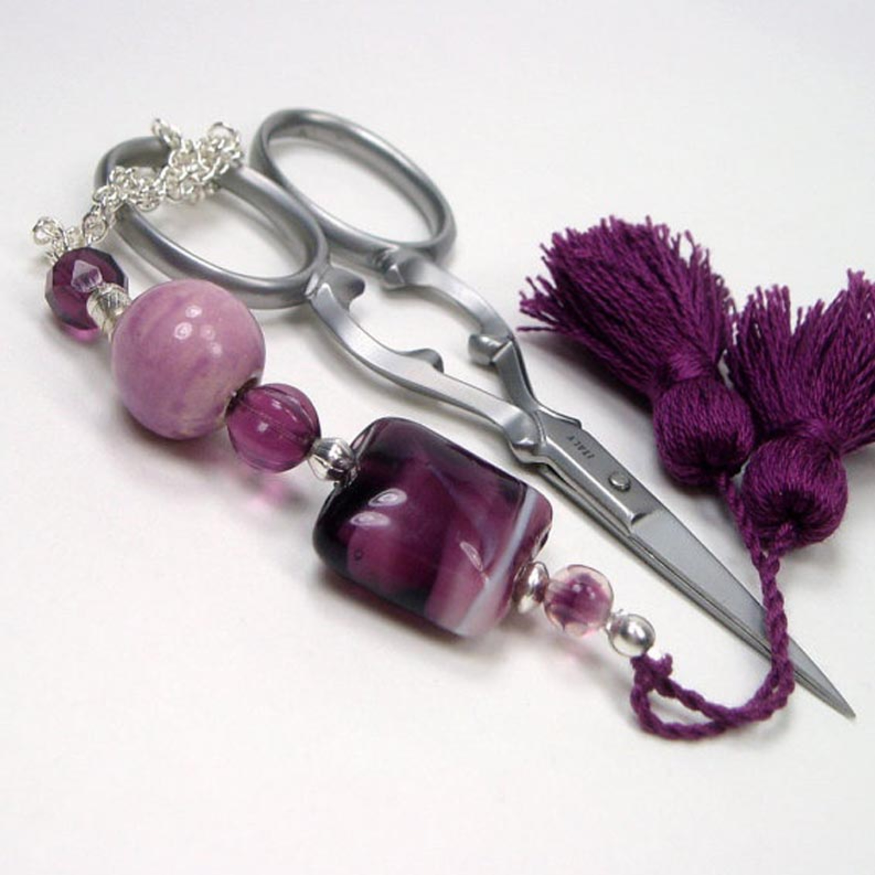 Everything you need to know about scissors fobs. Embroidery podcast episode artwork