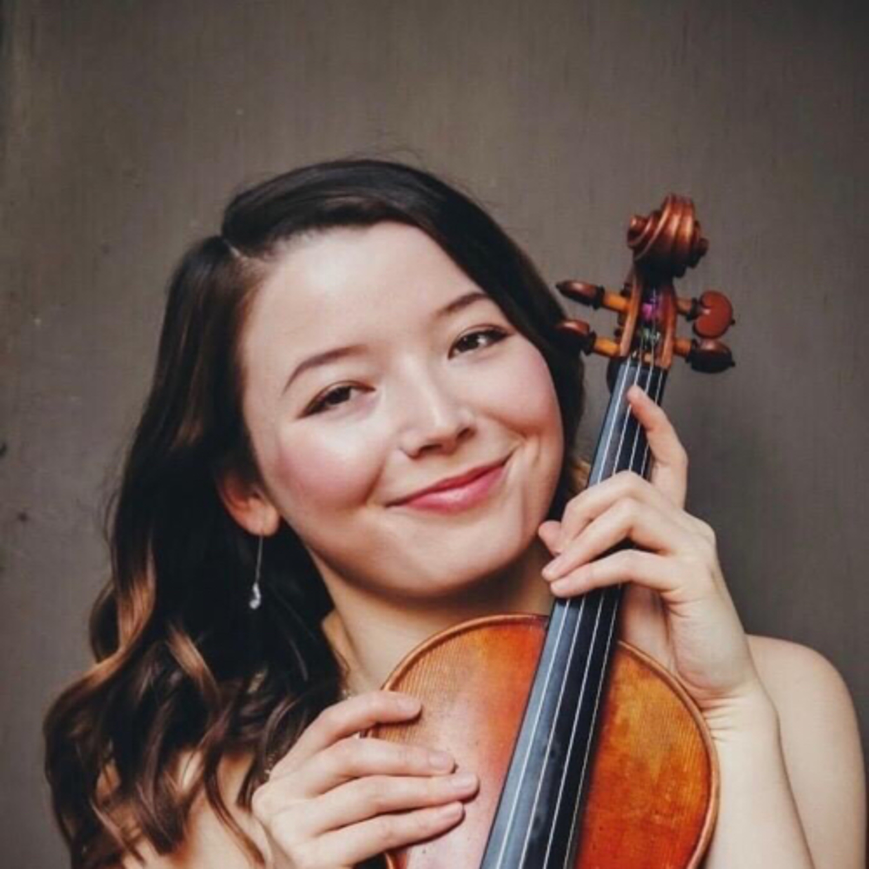 Yulia Price is a classically trained violinist currently working on her Masters Degree