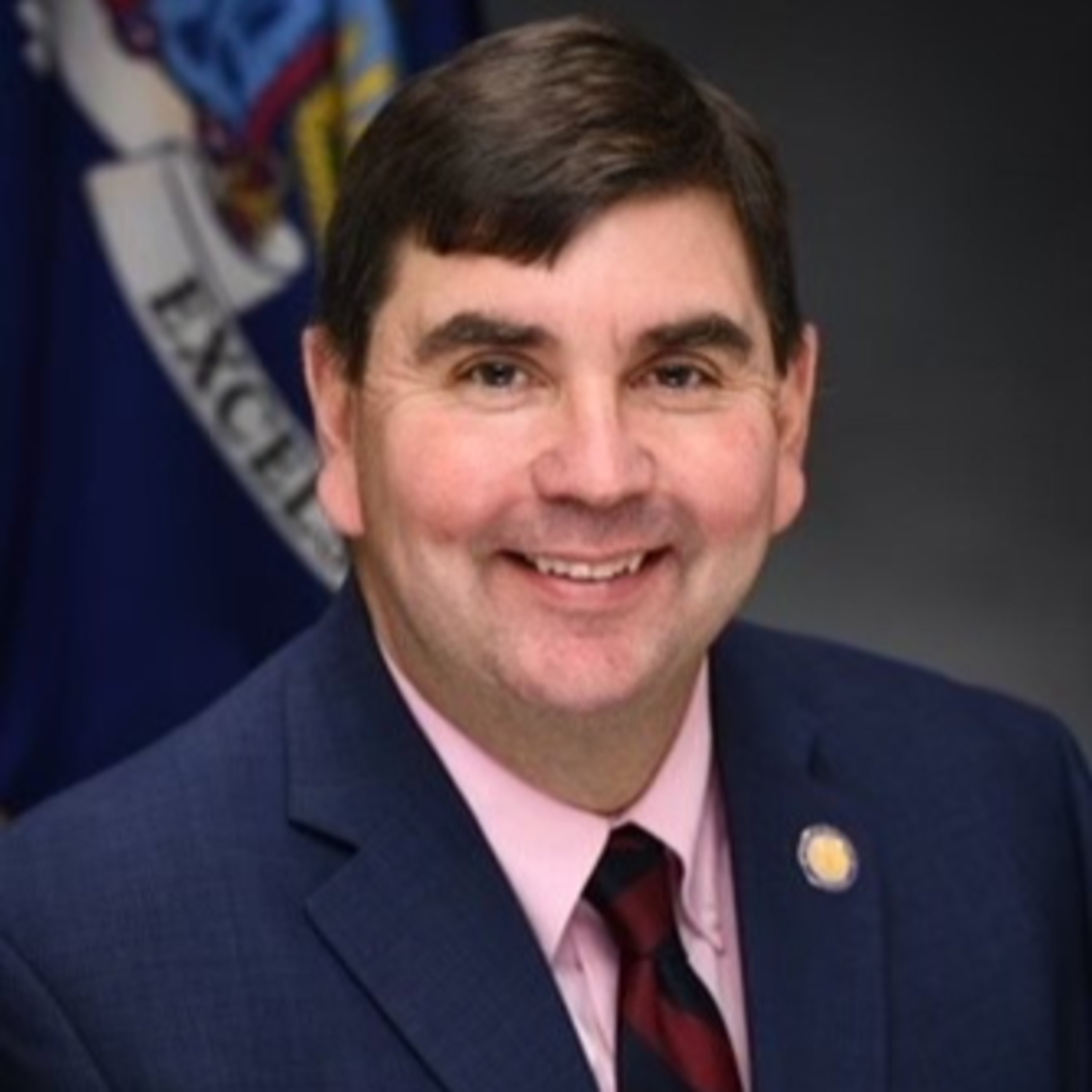 Commissioner in a Car