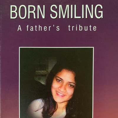 "Born Smiling: A Father's Tribute" by K Ravi