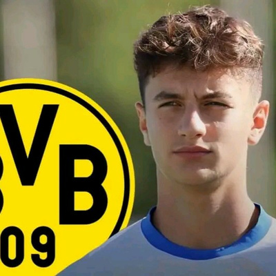 Luca Reggiani signs a contract as new Borussia Dortmund player. by