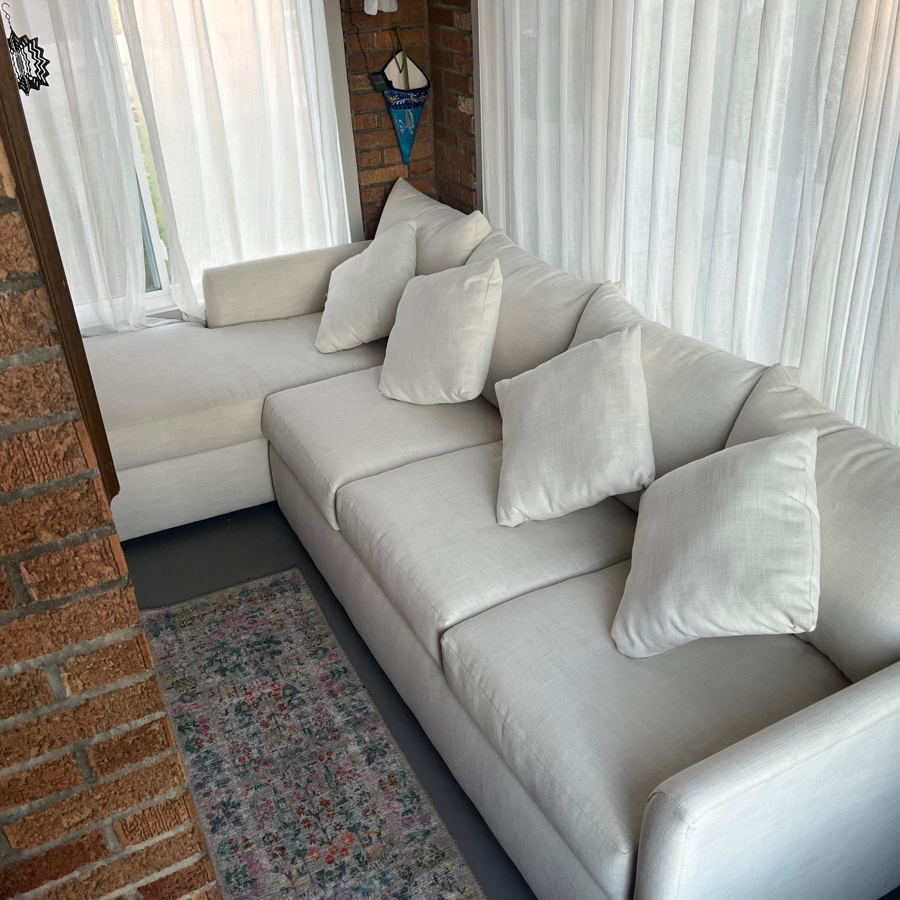 Episode 118: White couch in a pottery studio: