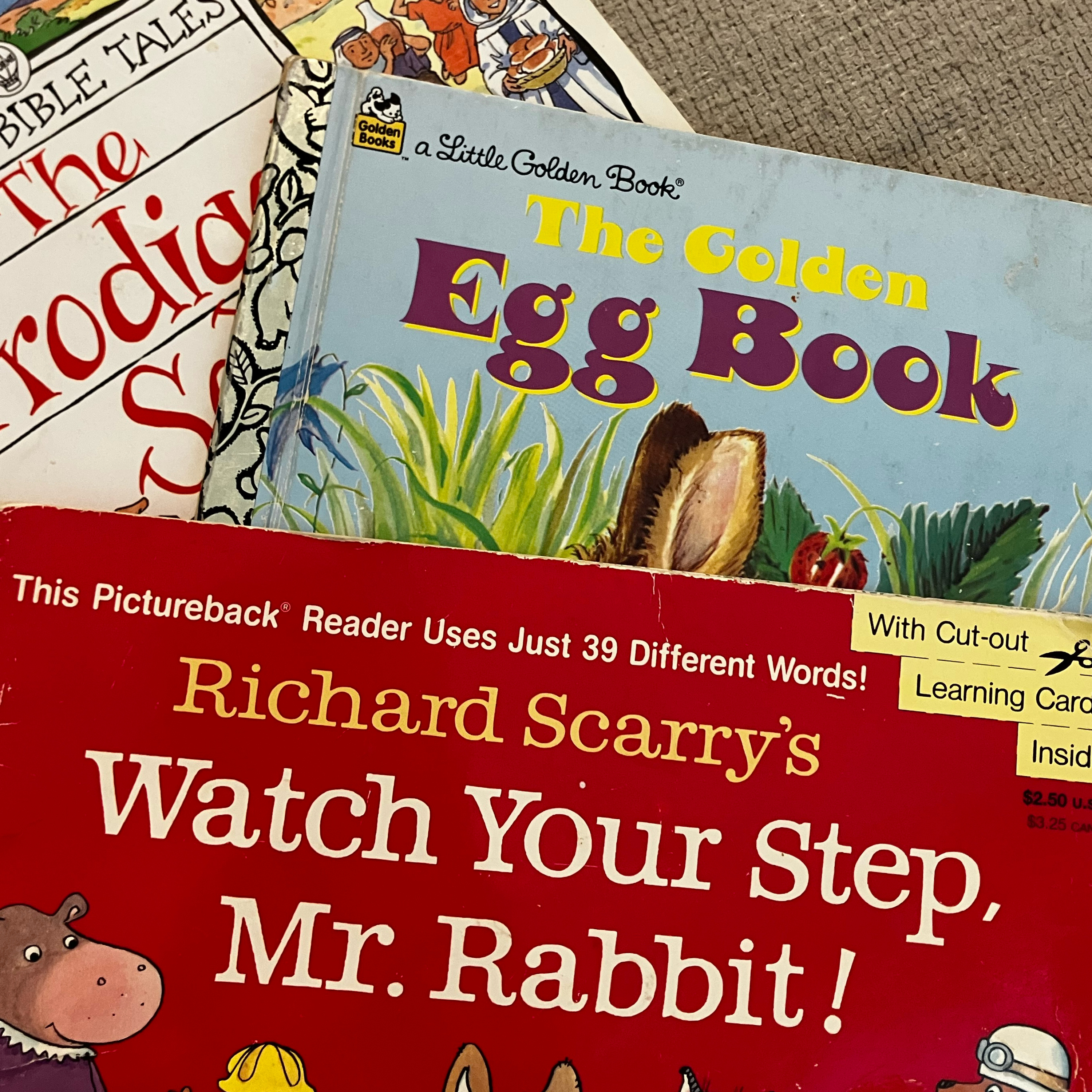 Three books with Adelaide episode artwork