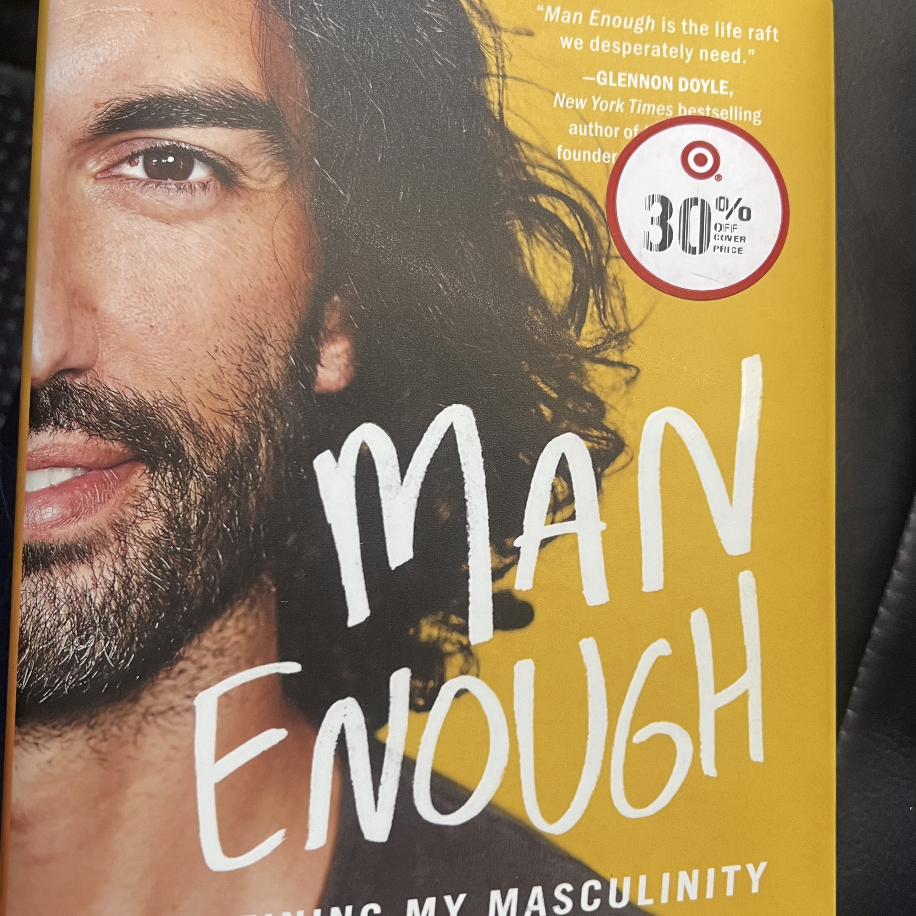 Reading the book of Man Enough by Justin Baldoni