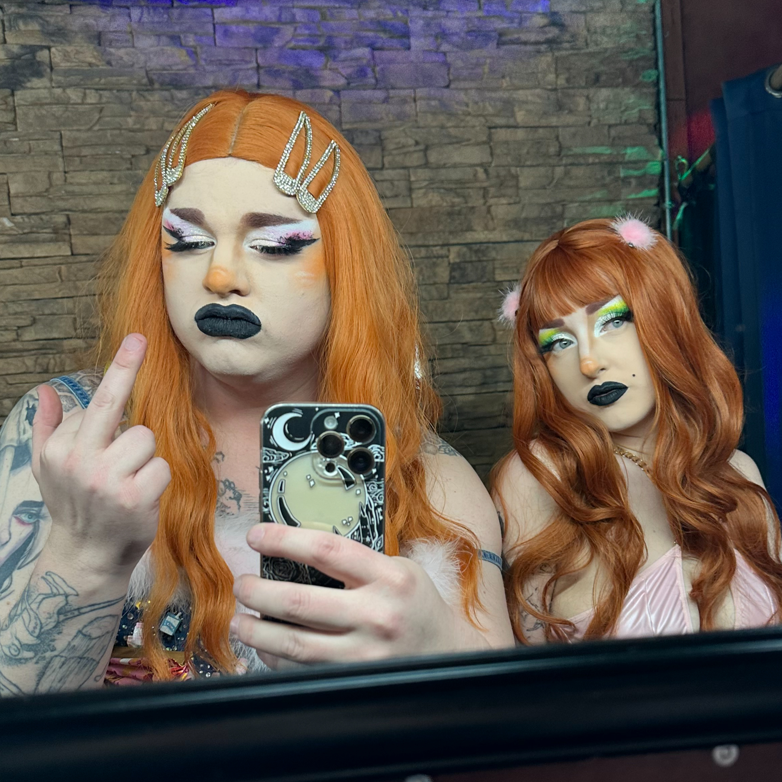 the one about serving comedy midnight on a wednesday, being called Sugar and Spice, a lasagna purse, revealing for charity, making no tips, being robbed, and who's gonna win Enby 7! episode artwork