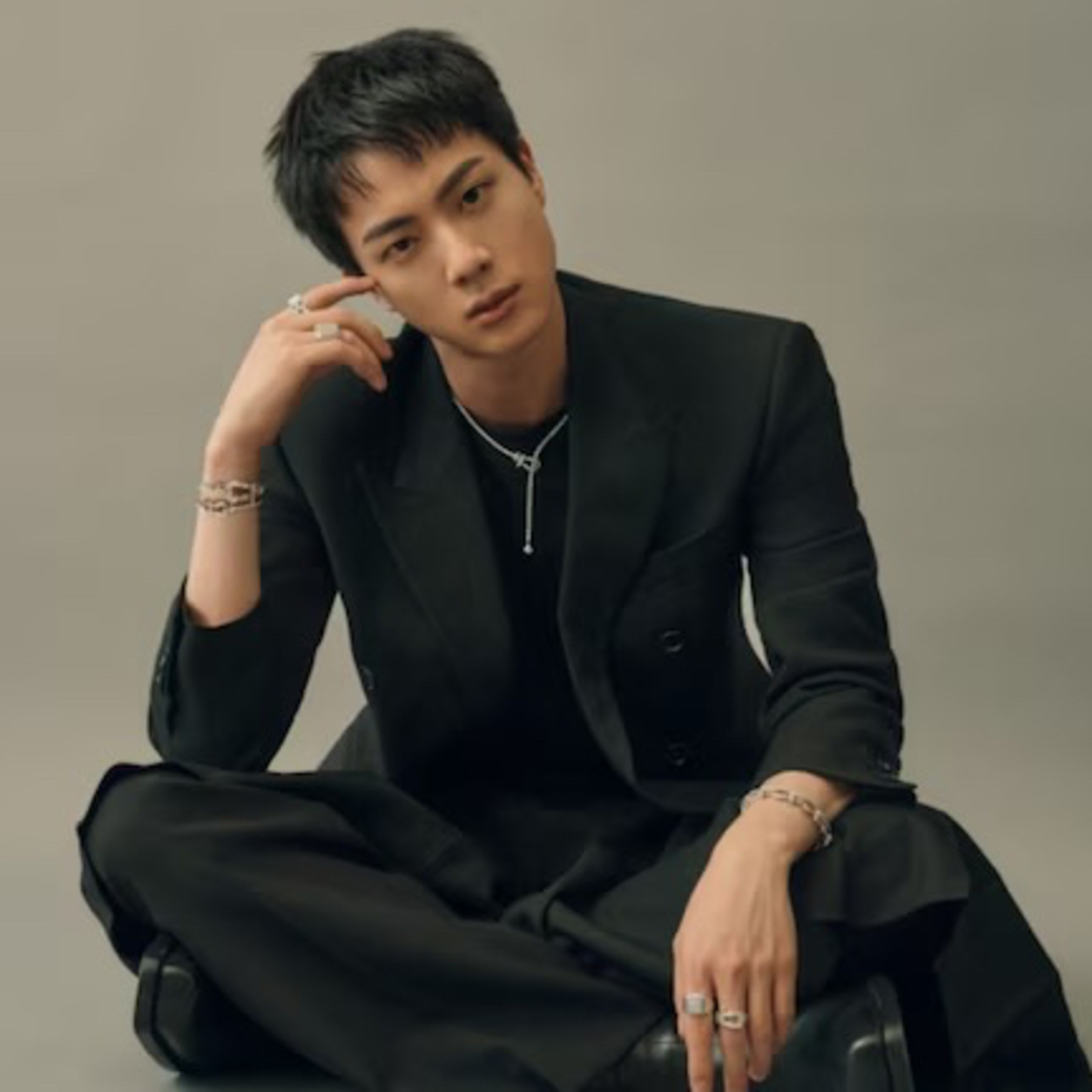 A female fan charged without detention for forcefully kissing BTS' Jin at an event